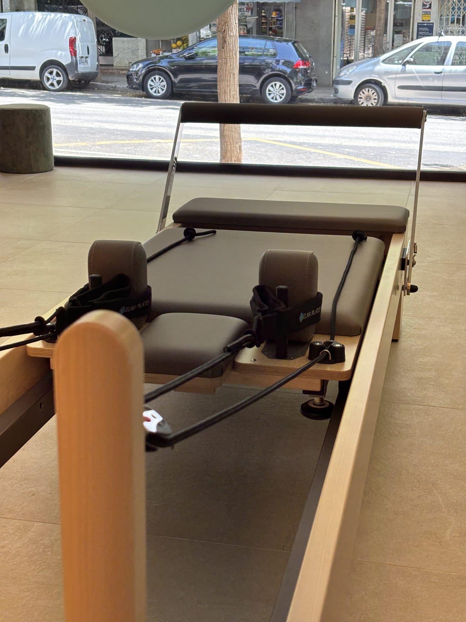 A Reformer beside the studio window, looking out onto the street